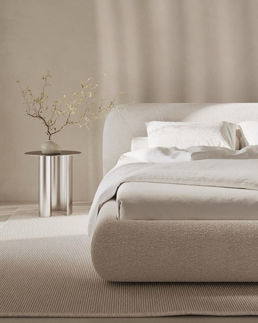 Upholstered headboard in a neutral bedroom