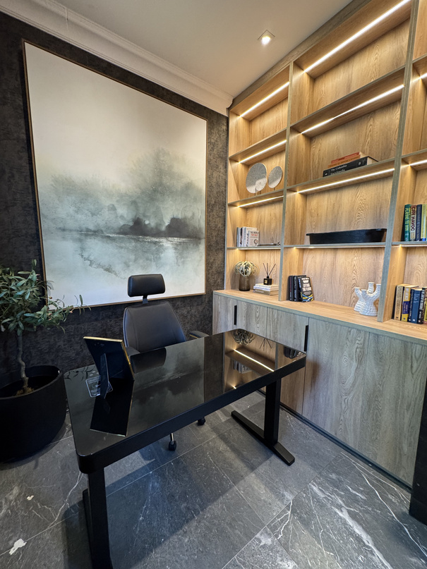 Bespoke study with timber shelving, landscape mural and glass desk